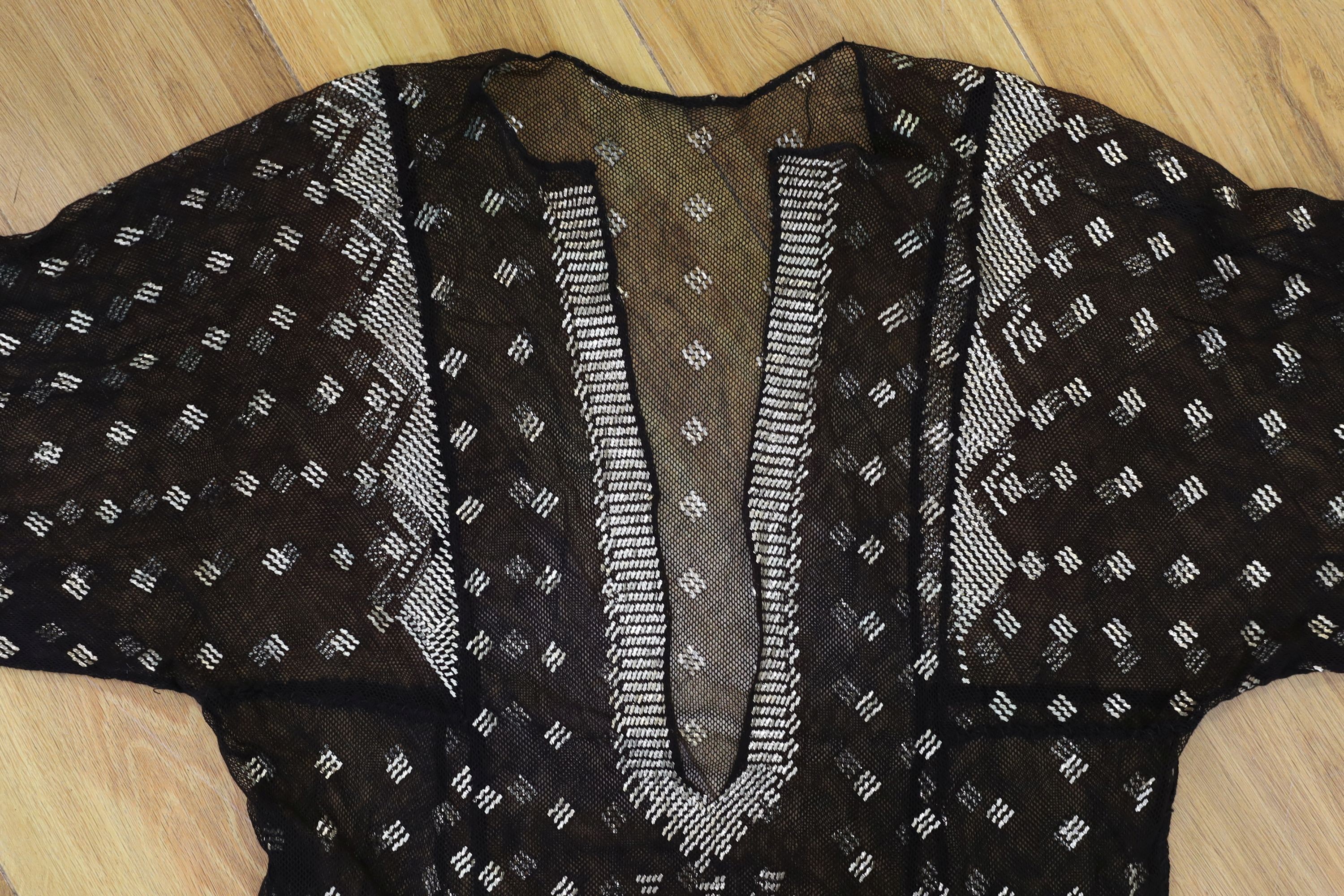 A dress made from a metal and black net Egyptian shawl; a similar shawl and a piece of shawl